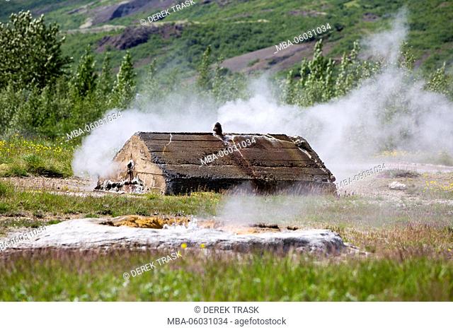 Strokkur Geysir Hot Spring Area, steam erupting from ground, South West Iceland, Golden Circle tour