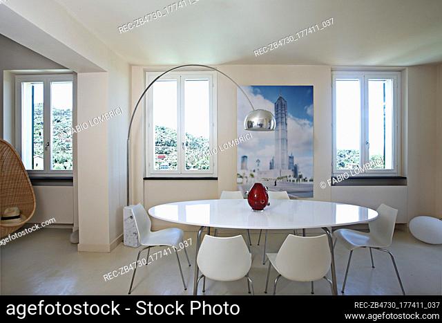White table and chairs in modern dining room