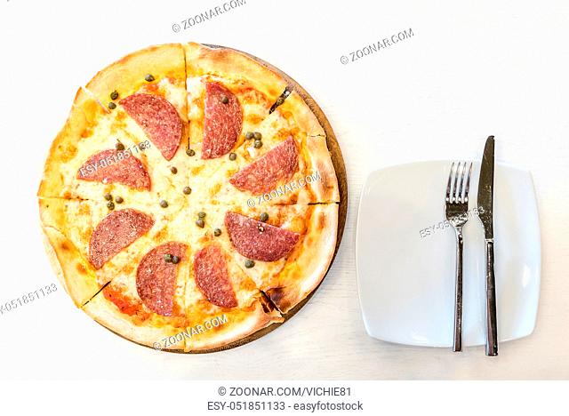 Italian Pepperoni pizza with salami Italian traditional food. Popular street food