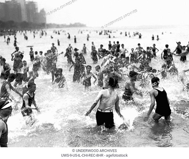 Chicago, Illinois: July 3, 1928 A water fight on a hot day at the Oak Street Beach which is the most popular beach for the near north siders