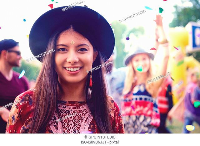 Portrait of young woman in trilby at festival