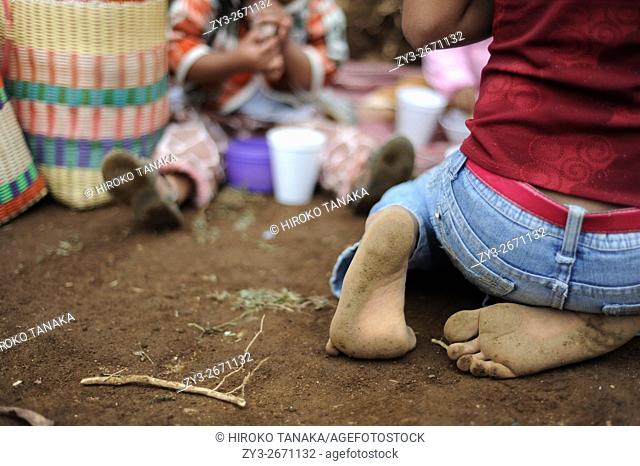 Maya indigenous girl in bare feet in Aqua Escondida, Solola, Guatemala