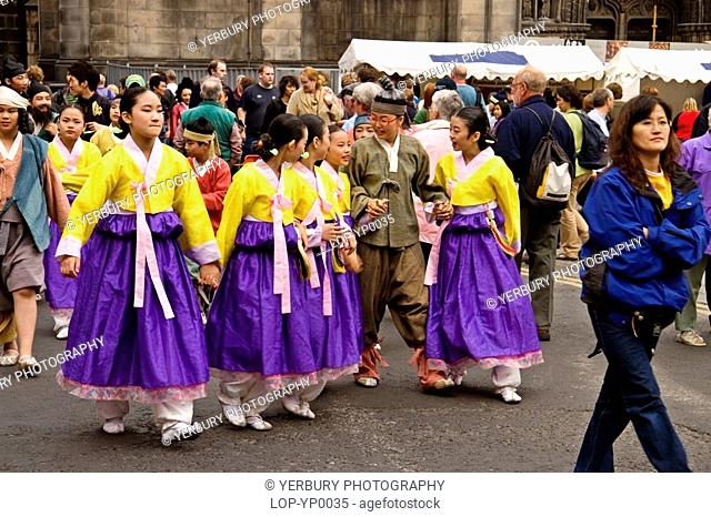 Scotland, Lothian, Edinburgh, Fringe performers walking in Edinburgh
