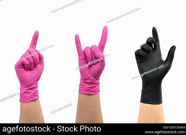 female hand in pink and black latex glove isolated on white background. The index finger is raised up, the gesture of pressing