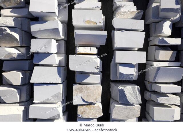 Aerial photographic documentation of a warehouse of white marble blocks ready for shipment