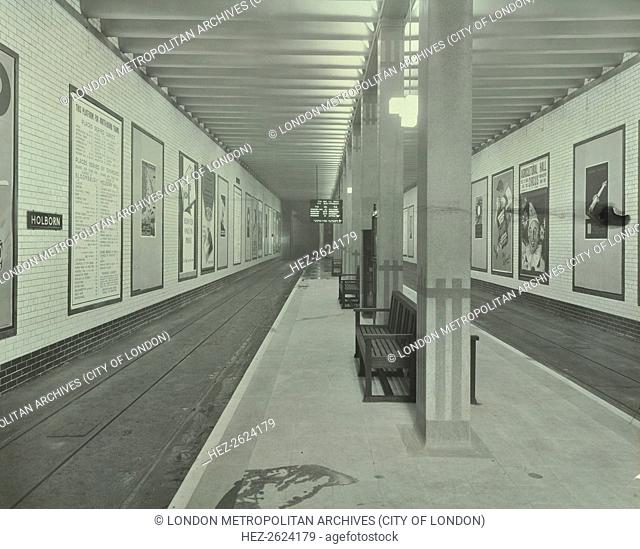 Platform with advertising posters, Holborn Underground Tram Station, London, 1931. Advertising posters on the north-bound platform at Holborn Underground Tram...
