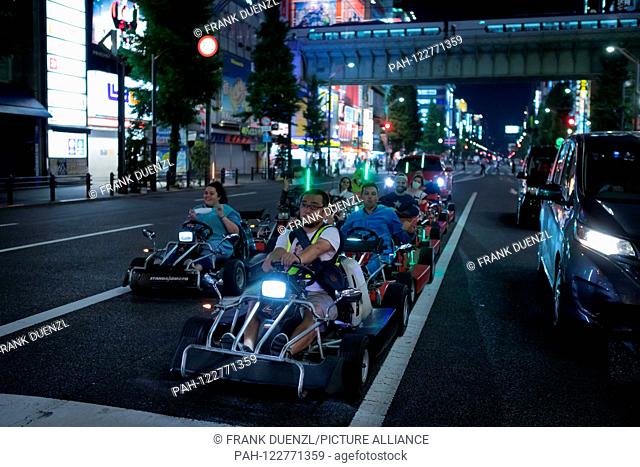 Go-karts that resemble Mario Karts, but may not be called Mario Karts, on a street in Akihabara, in May 2019. | usage worldwide. - Tokyo/Tokyo/Japan