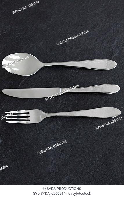 close up of fork, knife and spoon on table