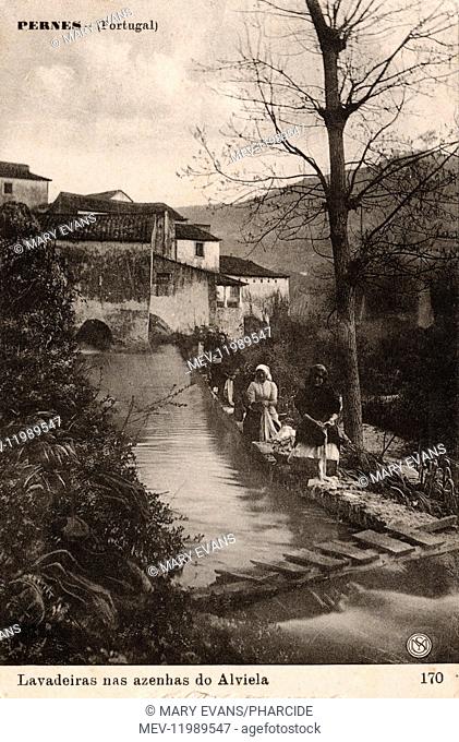 Washerwomen at work by the River Alviela at Pernes, Santarem district, Portugal
