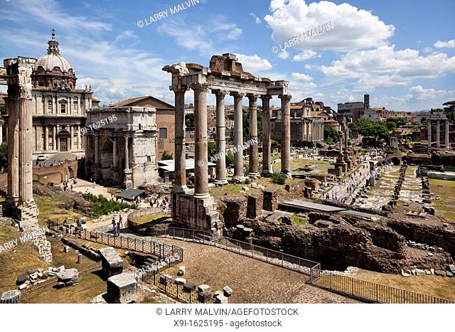 Panoramic view of the Roman Forum with the Colosseum in the distance in Rome, Italy