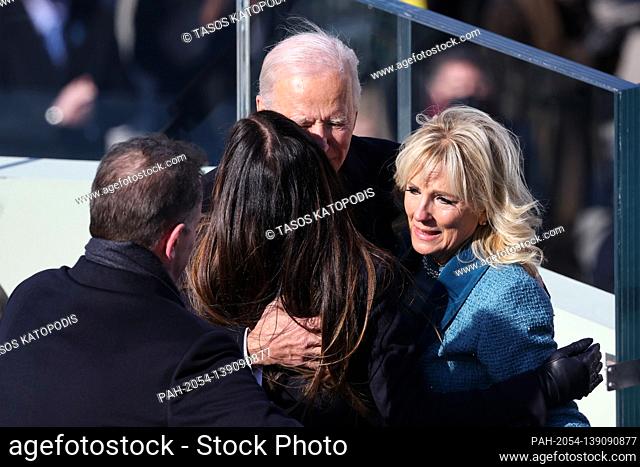 WASHINGTON, DC - JANUARY 20: U.S. President Joe Biden hugs his wife Dr. Jill Biden, son Hunter Biden and daughter Ashley Biden after being sworn in as U
