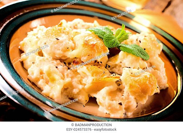 Gnocchi with cheese in the plate.selective focus on the top