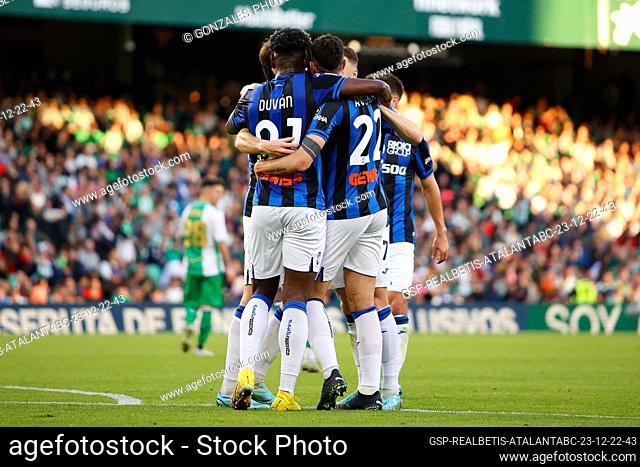 Seville, Spain. 23rd, December 2022. Marten de Roon (15) of Atalanta scores for 0-2 and celebrates with team mates during the football friendly between Real...