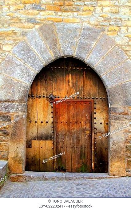 Romanesque arch door wooden medieval Ainsa