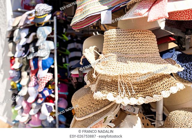 Woman's straw hats , for sale at a market
