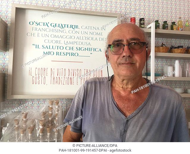 11 July 2018, Italy, Lampedusa: Vito Fiorino, ice cream parlour owner and fisherman, stands in his ice cream parlour on the Italian island of Lampedusa