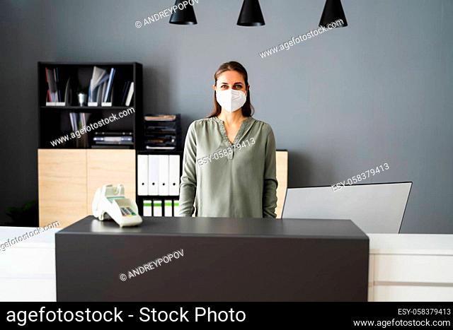 Receptionist Woman At Office Reception Wearing Face Mask