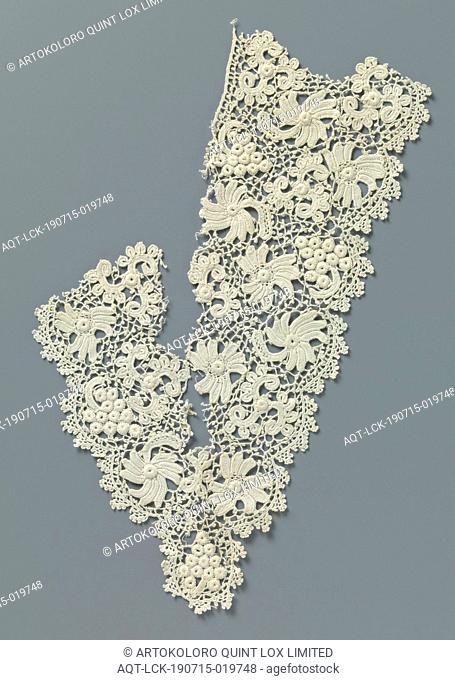 Fragment crocheted lace with flowers and bunch of grapes, V-shaped part of a piece of natural Irish crocheted lace. Pattern with flowers and bunches of grapes...