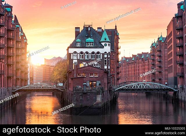 Hamburg Old Port, Germany, Europe, historic warehouse district with moated palace in the golden light of sunset