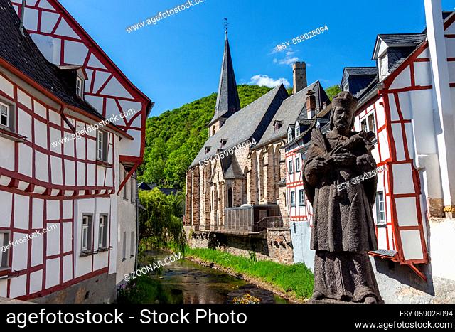 View from an old bridge on River elz and half-timbered houses in Monreal, Eifel, Germany