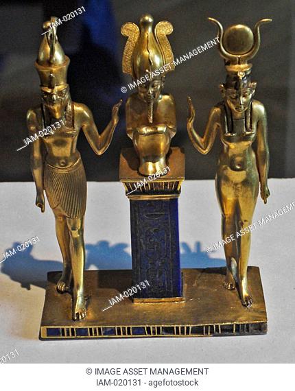 three gods statuette for King Osorkon II depicts the family of the god Osiris Osiris is flanked by Horus left and Isis right