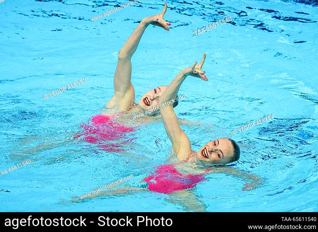 RUSSIA, KAZAN - DECEMBER 10, 2023: Swimmers Valeria Volosach and Margarita Kirilyuk of Belarus perform their duet free routine during the Synchronised Swimming...