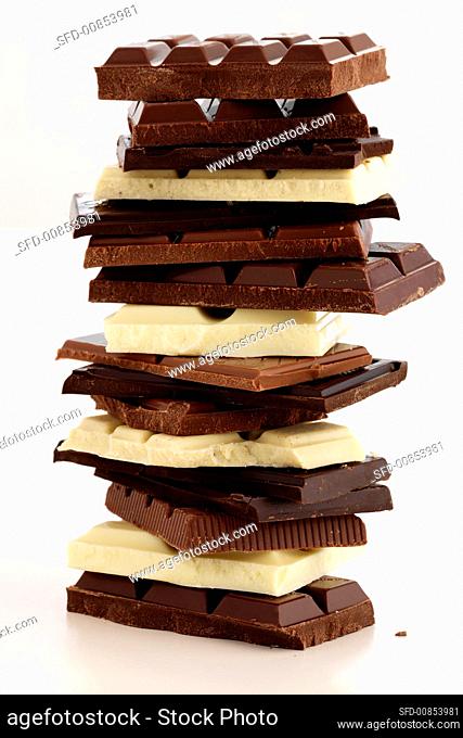 Pieces of white and dark chocolate, in a pile