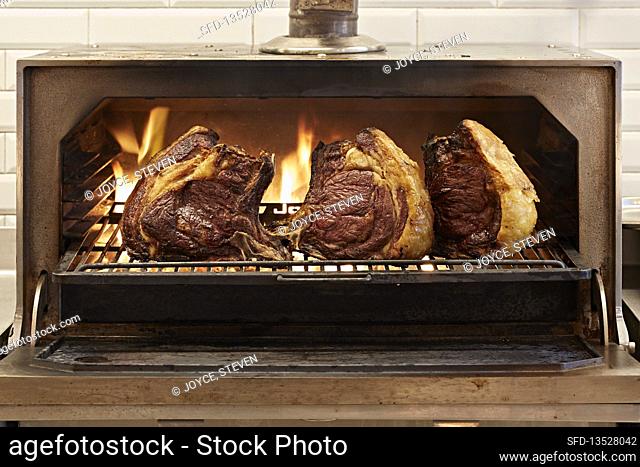 Beef cooking over flames