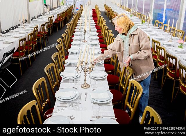 15 April 2022, Berlin: A woman sets a table at the beginning of Passover at the Chabad Lubavitch Jewish Educational Center Berlin