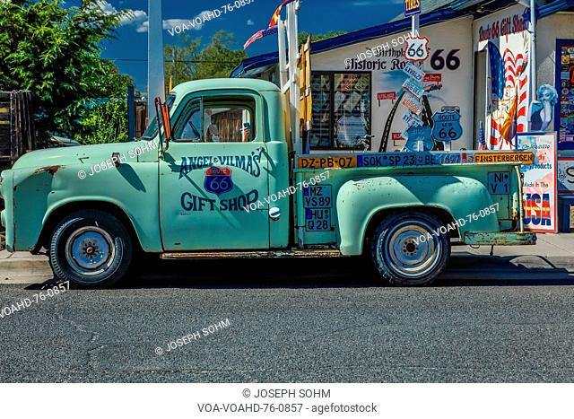 Green pickup truck Main Street, Seligman on historic Route 66, Arizona, USA, July 22, 2016