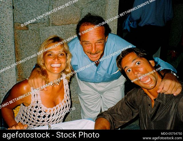 Italian television presenter and showgirl Simona Ventura posing smiling with her husband, the Italian football player Stefano Bettarini