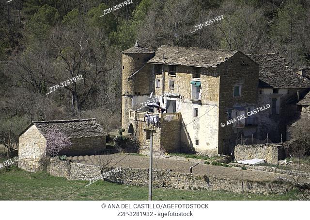Landscape in Sobrarbe county Huesca Aragon Spain. Medieval farm with round tower. Arro village