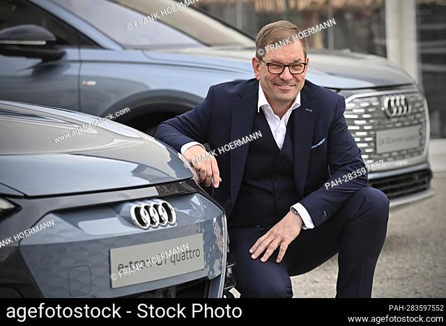 Markus DUESMANN (Management Chairman of AUDI AG) poses at the front of an Audi e-tron gt quattro. Ludwig Erhard Summit 2022 at Gut Kaltenbrunn am Tegernsee on...