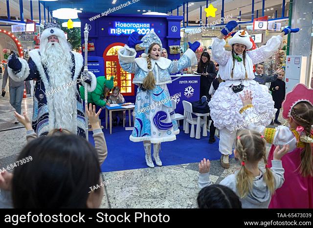 RUSSIA, MOSCOW - DECEMBER 4, 2023: Performers dressed as Father Frost (Russia equivalent of Santa), Snow Maid and Snowman entertain children during a ceremony...