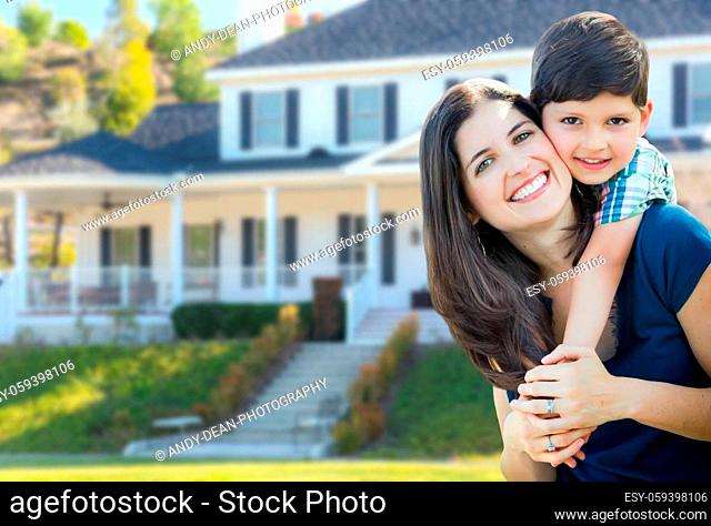 Young Mother and Son In Front Yard of Beautiful Custom House