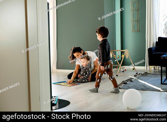 Mother with sons at home