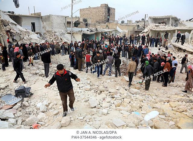 People search the rubble for dead bodies and injured victims on February 23, 2013 at a site were houses were hit by a missile attack the evening before in the...
