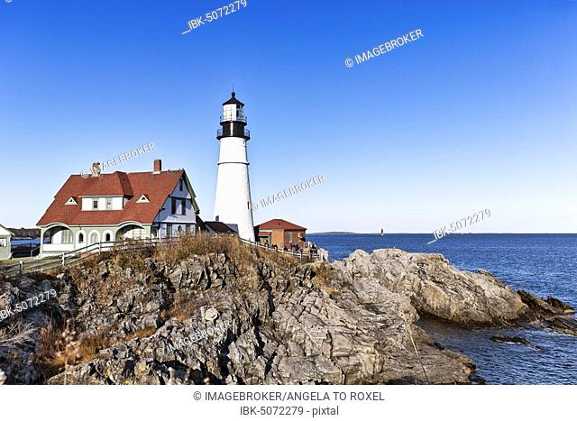 Lighthouse on rocky coast, Portland Head lighthouse, Cape Elizabeth, Portland, Maine, New England, USA, North America