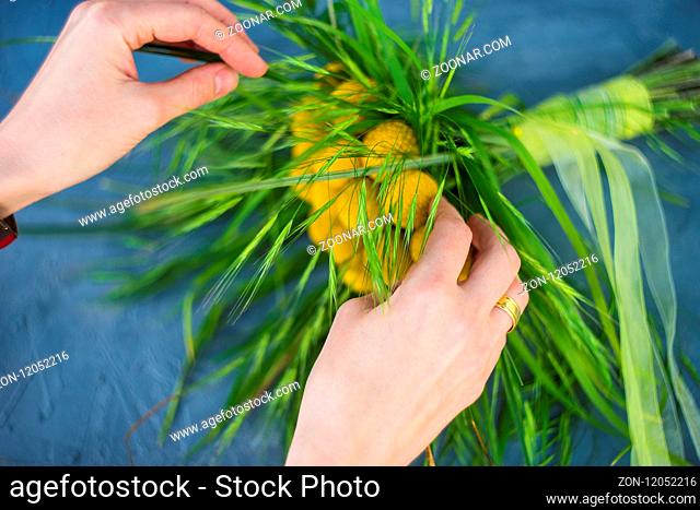 Beautiful yellow billy balls or craspedia flowers in bride bunch on rustic background with copy space