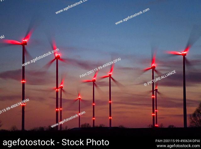 15 January 2020, Brandenburg, Sieversdorf: Red position lights shine on wind turbines in the ""Odervorland"" wind farm in the Oder-Spree district
