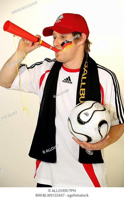 German football fan using a whistle