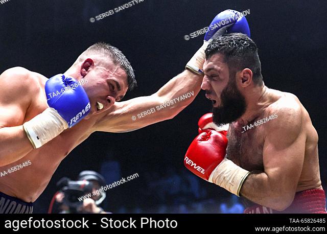 RUSSIA, MOSCOW - DECEMBER 16, 2023: Boxers Orkhan Gadzhiev (red) of Russia and Konstantin Ponomarev of Russia fight in a boxing bout as part of the IBA...