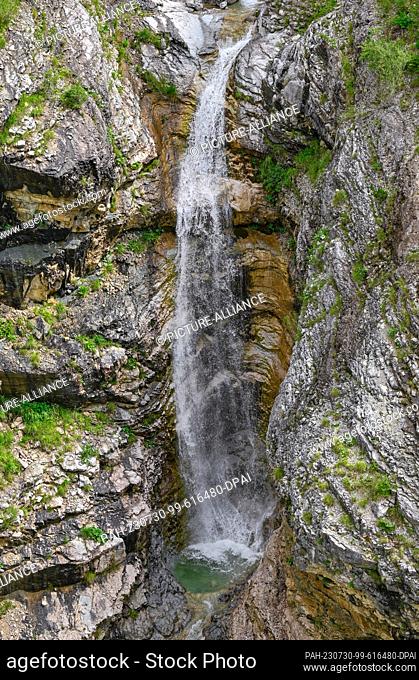 26 July 2023, Slovenia, Strmec: A small waterfall in the Triglav National Park. Almost the entire area of Triglav National Park is located in the Julian Alps
