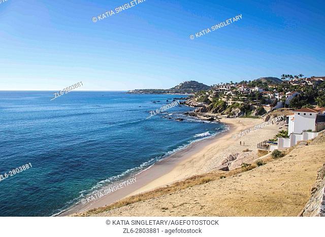 Empty beach in Cabos San Lucas, Baja California, Mexico. Ocean and mountains on a blue sky and sunny day
