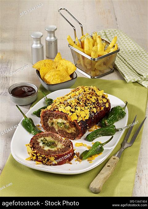 Hearty meatloaf with bacon, nachos and wasabi peanuts