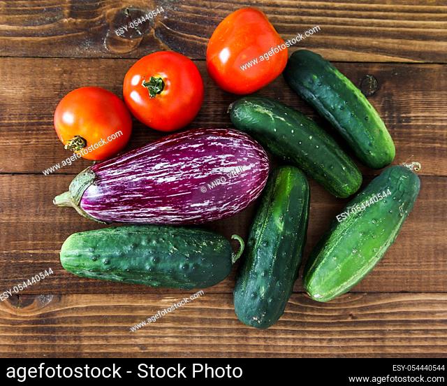 Mixed vegetables from garden on wooden background