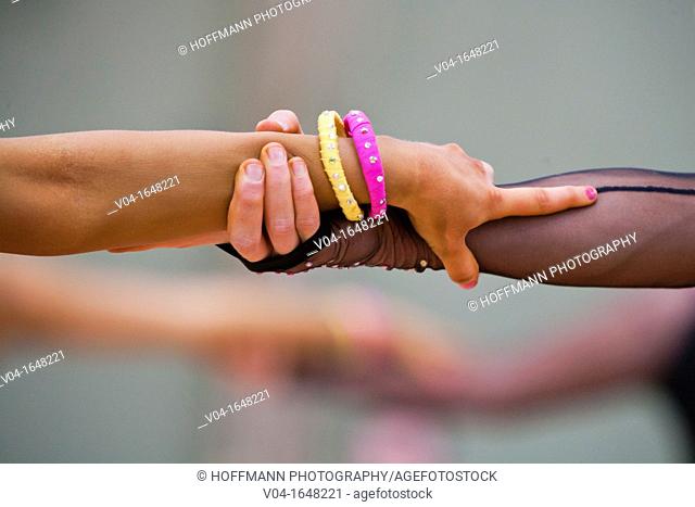 Couple holding hands at a dancing competition in Germany, Europe