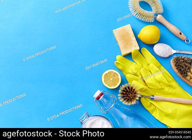 vinegar, lemons, washing soda, gloves and brush