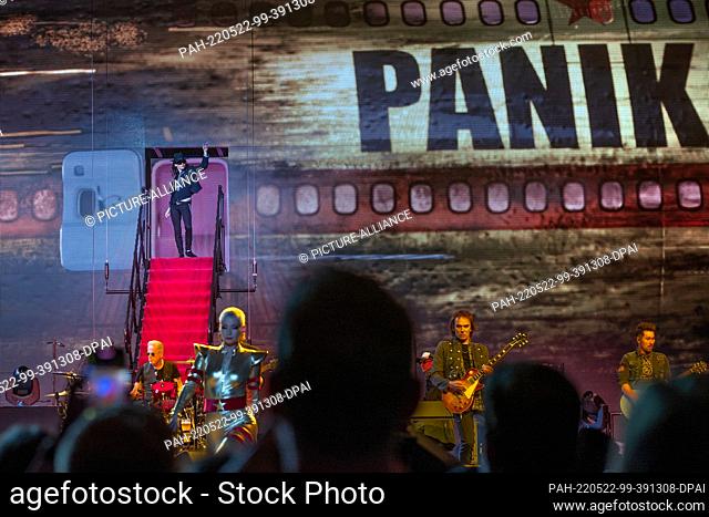 22 May 2022, Mecklenburg-Western Pomerania, Schwerin: A dancer in Udo Lindenberg's outfit gets off the panic plane during the public dress rehearsal for the...
