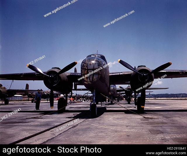 B-25 bombers on the outdoor assembly line at North American Aviation.., Kansas City, Kansas, 1942. Creator: Alfred T Palmer